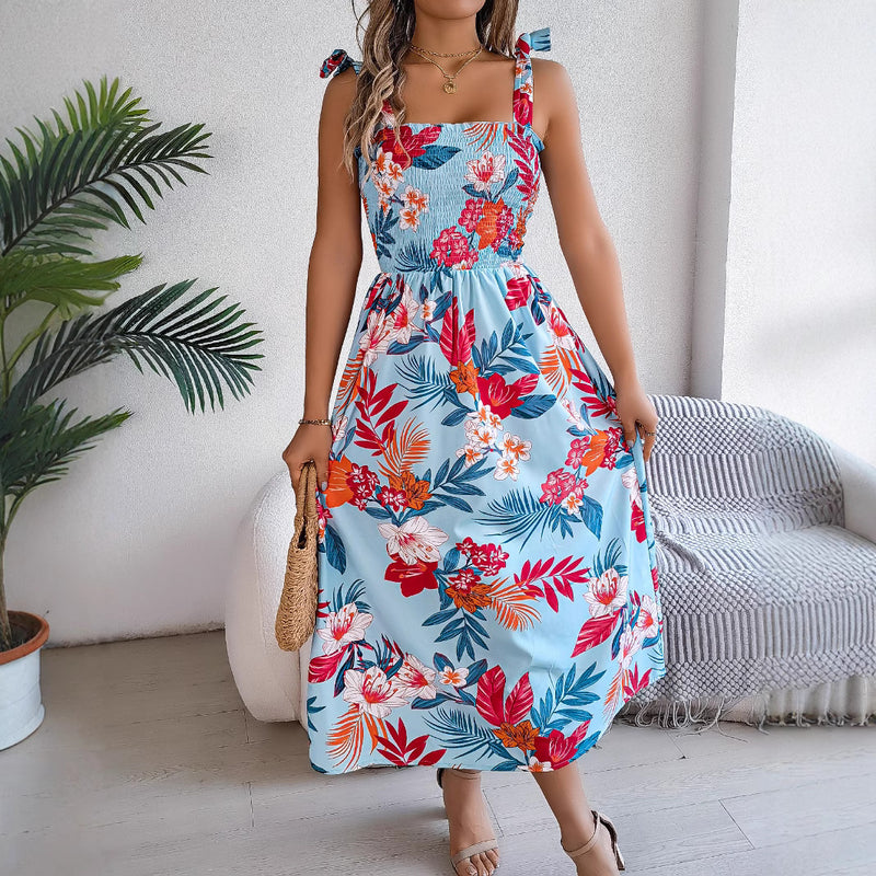 Sommarklänning för kvinna med blommigt tryck, ärmlös korsettliv och högmidjad, flödande kjol